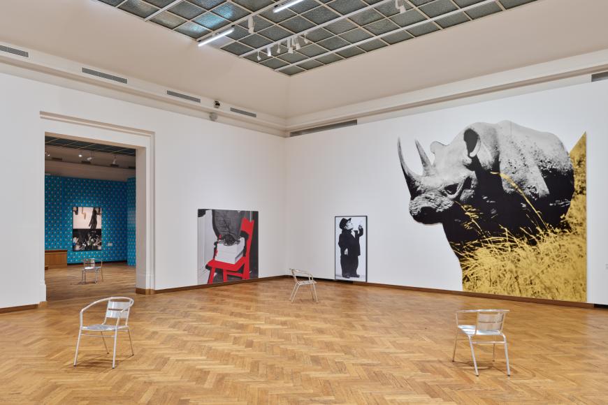 Dwarf and Rhinoceros (With Large Black Shape) © We Document Art